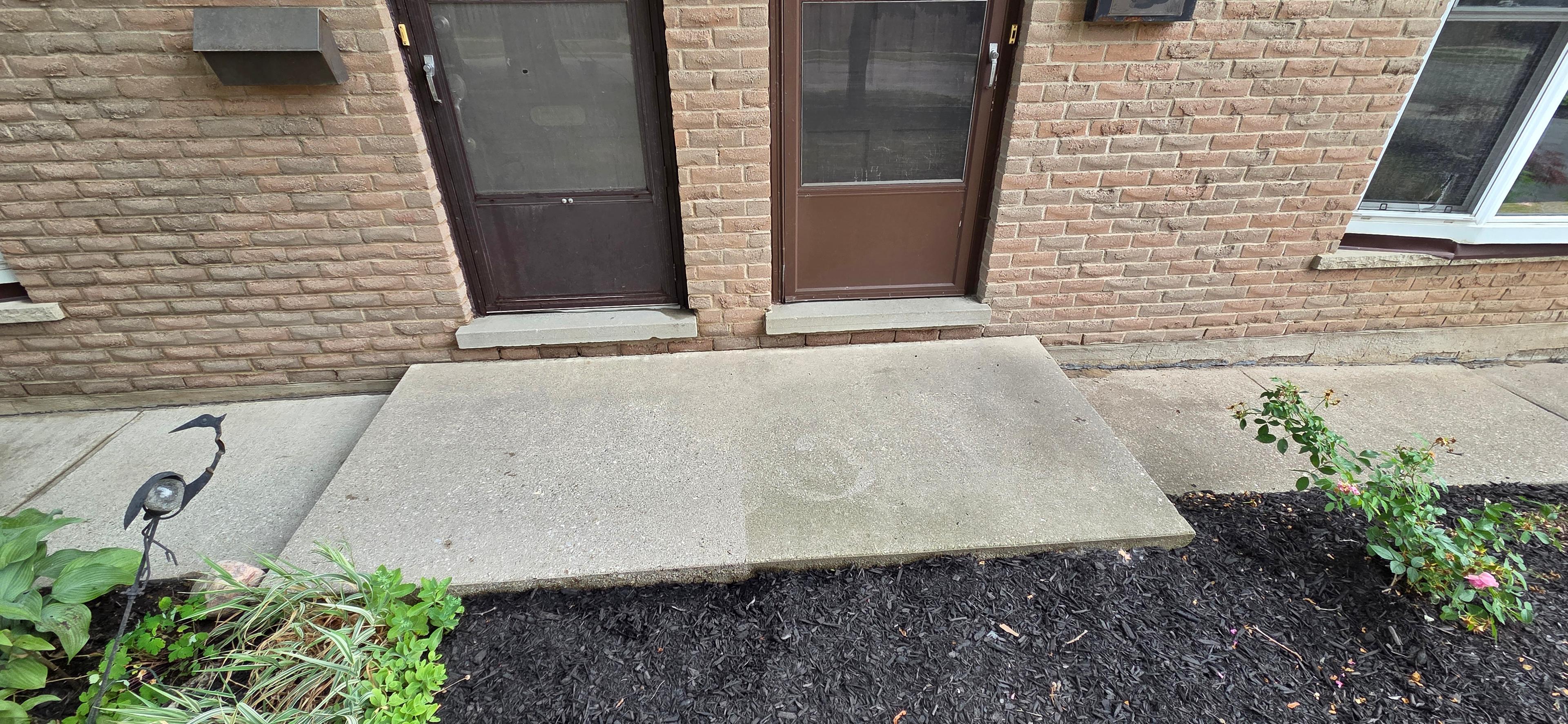 Cleaned property entrance completed by Grime and Growth